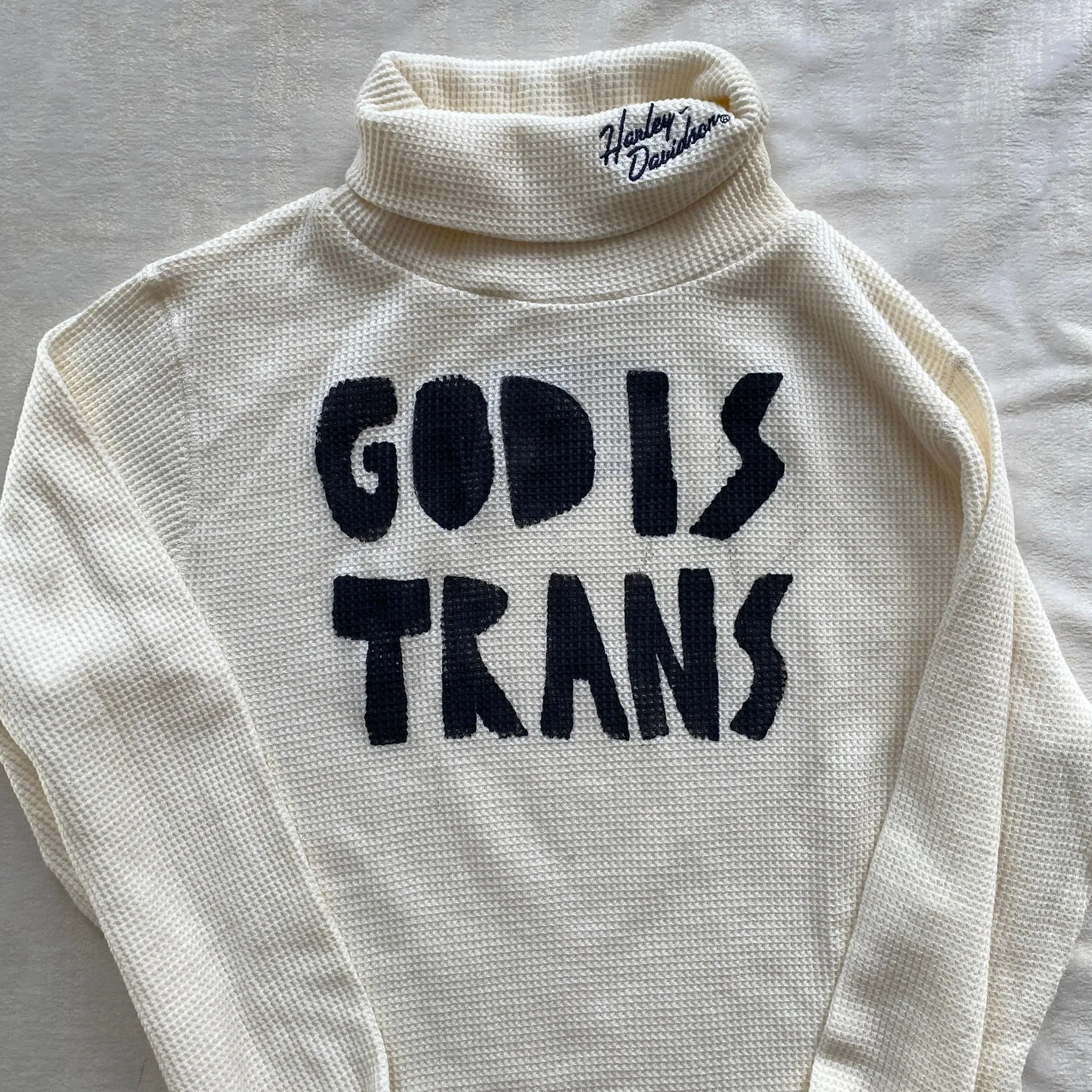 GOD IS TRANS painted waffle turtleneck